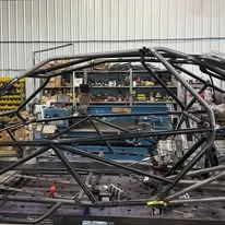 Bare tube chassis of the sand car in the shop